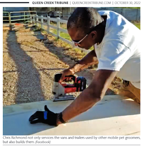 Chris Richmond working on a mobile grooming trailer, featured in the Queen Creek Tribune